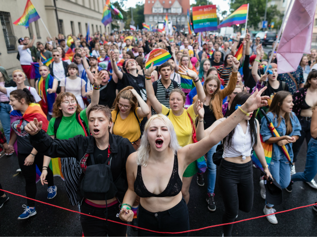 Participants of a gay pride parade walk through the streets of Poznan, August 11, 2018. (Photo by Wojtek RADWANSKI / AFP) (Photo credit should read WOJTEK RADWANSKI/AFP/Getty Images)