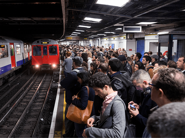 LONDON, ENGLAND - APRIL 30: Commuters prepare to travel on the District Line of the London