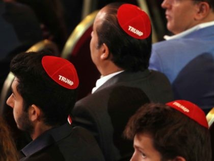 Men attending the Republican Jewish Coalition's annual leadership meeting wear red yarmulkes with the word "Trump" on them, Saturday April 6, 2019, as they wait for President Donald Trump to arrive to speak in Las Vegas. (AP Photo/Jacquelyn Martin)