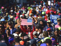 Central American migrants -mostly from Honduras- wanting to reach the United States in hope of a better life, are stopped by federal police officers before arriving at El Chaparral port of entry in the US-Mexico border, in Tijuana, Baja California State, Mexico on November 25, 2018. Migration (Photo by Pedro …