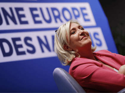 Far-right leader of the National Rally party Marine Le Pen, smiles as she attends a media conference for the upcoming European elections next month in Strasbourg, eastern France, Monday, April 15, 2019. Background reads, a Europe of Nations. (AP Photo/Jean-Francois Badias)