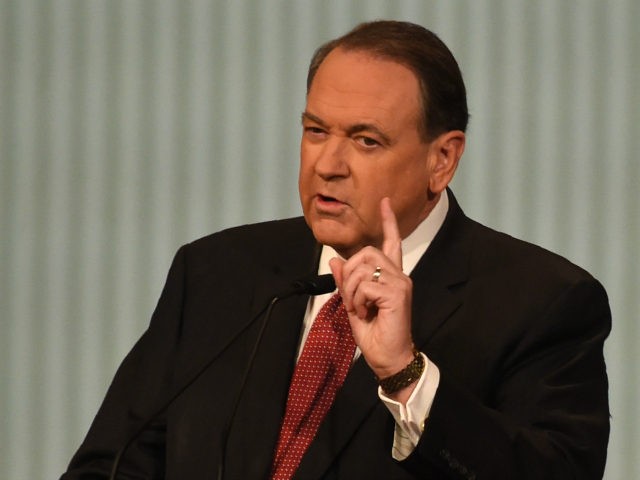 Republican Presidential candidate Mike Huckabee gestures during the under card Republican