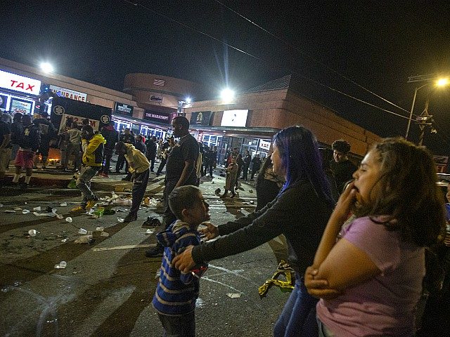 LOS ANGELES, CA - APRIL 01: People react in the aftermath of a stampede at a gathering of hundreds of people mourning the murder of Nipsey Hussle on April 1, 2019 in Los Angeles, California. The otherwise peaceful gathering at the site where Hussle was murdered was cut short by …