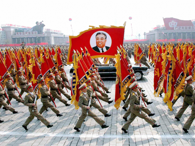 Pyongyang, DEMOCRATIC PEOPLE'S REPUBLIC OF: This 25 April 2007 picture, released from Korean Central News Agency 26 April, shows North Korean soldiers, carrying a large portrait of late North Korean leader Kim Il Sung, marching during a grand military parade to celebrate the 75th founding anniversary of the KPA at â¦