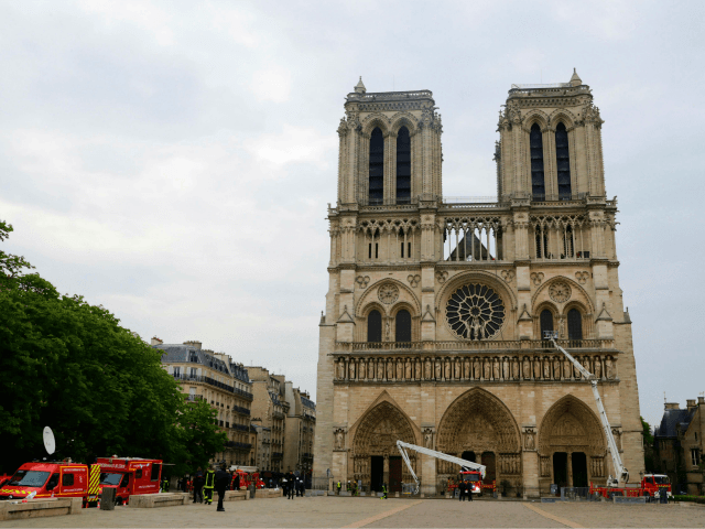 Firefighters secure Notre-Dame Cathedral in Paris on April 16, 2019, in the aftermath of a