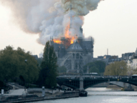 TOPSHOT - Smokes ascends as flames rise during a fire at the landmark Notre-Dame Cathedral in central Paris on April 15, 2019 afternoon, potentially involving renovation works being carried out at the site, the fire service said. (Photo by FRANCOIS GUILLOT / AFP) (Photo credit should read FRANCOIS GUILLOT/AFP/Getty Images)