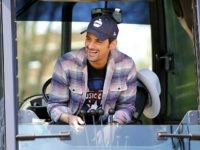 Country music star Brad Paisley gets ready to operate a backhoe to break ground for The Store, a free grocery store for people in need, Wednesday, April 3, 2019, in Nashville, Tenn. (AP Photo/Mark Humphrey)