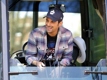 Country music star Brad Paisley gets ready to operate a backhoe to break ground for The St