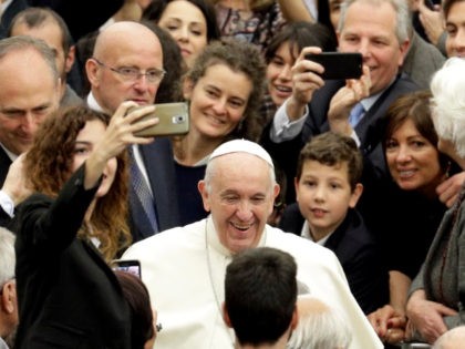 Pope Francis arrives on the occasion of an audience with high school Liceo Visconti students in the Paul VI hall at the Vatican, Saturday, April 13, 2019. (AP Photo/Gregorio Borgia)