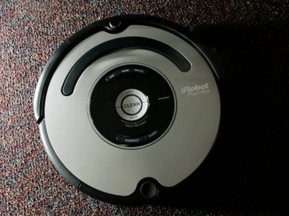 The Roomba vacuum cleaner by iRobot Corp. is seen in Boston on Tuesday, Aug. 21, 2007. Nearly five years after rolling onto the market, the Roomba vacuum cleaner has undergone a ground-up redesign that has endowed the otherwise-brainy robot with the smarts to overcome rug tassels and electrical cords. (AP …