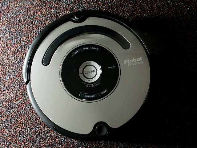 The Roomba vacuum cleaner by iRobot Corp. is seen in Boston on Tuesday, Aug. 21, 2007. Nea