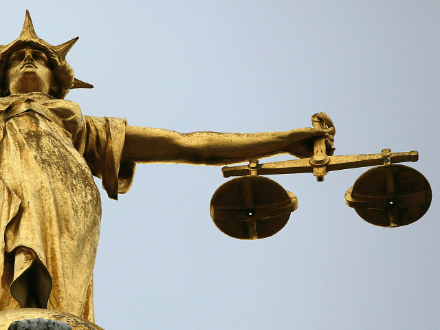 LONDON, ENGLAND - FEBRUARY 16: A statue of the scales of justice stands above the Old Bailey on February 16, 2015 in London, England. (Photo by Dan Kitwood/Getty Images)
