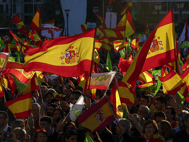 MADRID, SPAIN - APRIL 26: Supporters of far right wing party VOX wave Spanish and Vox flags in the air during the VOX closing rally on April 26, 2019 in Madrid, Spain. Spaniards go to the polls to elect 350 members of the parliament and 208 senators this Sunday. This …