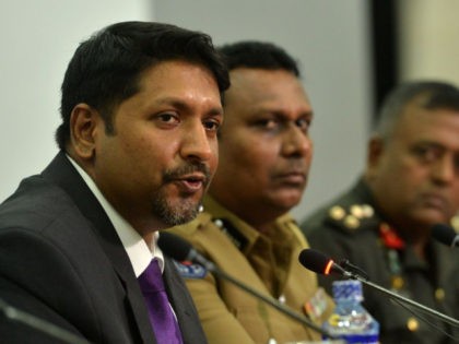 Sri Lanka's state minister of defence Ruwan Wijewardene (L) speaks during a press conference in Colombo on April 24, 2019. - A Sri Lankan security dragnet hunting those responsible for horrifying bombings that claimed more than 350 lives has scooped up a further 18 suspects, police said April 24, as …