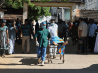 Graphic content / Sri Lankan hospital workers transport a body on a trolley at a hospital morgue following an explosion at a church in Batticaloa in eastern Sri Lanka on April 21, 2019. - A series of eight devastating bomb blasts ripped through high-end hotels and churches holding Easter services …