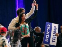A woman protests as President Donald Trump speaks at an annual meeting of the Republican Jewish Coalition, Saturday, April 6, 2019, in Las Vegas. (AP Photo/John Locher)