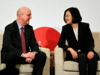 Taiwan's President Tsai Ing-wen, right, talks to David Meale, Deputy Assistant Secretary at U.S. Department of State during the 2019 Hsieh Nien Fan annual dinner of the American Chamber of Commerce in Taipei, Taiwan, Wednesday, April 10, 2019. (AP Photo/Chiang Ying-ying)