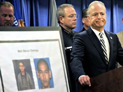 United States Attorney Nick Hanna stands next to photos of Mark Steven Domingo, during a news conference in Los Angeles on Monday, April 29, 2019. A terror plot by Domingo, an Army veteran who converted to Islam and planned to bomb a white supremacist rally in Southern California as retribution …