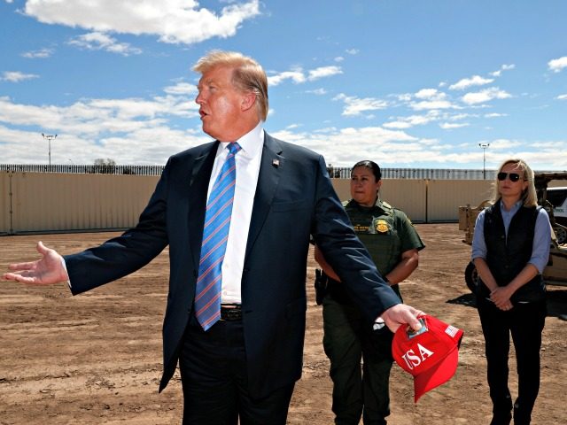 President Donald Trump visits a new section of the border wall with Mexico in Calexico, Ca
