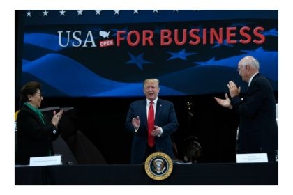 President Donald Trump, center, arrives to speak during a roundtable discussion at Nuss Tr