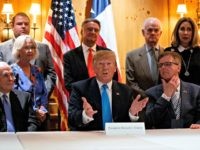 President Donald Trump speaks with reporters about border policy during a fundraising event, Wednesday, April 10, 2019, in San Antonio. (AP Photo/Evan Vucci)