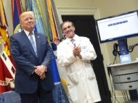 WASHINGTON, DC - AUGUST 3: (AFP OUT) U.S. President Donald J. Trump(left) listens to applause with Veterans Affairs Secretary Dr.David Shulkin(right) at the announcement by the Department of Veterans Affairs outlining a new program using video and software technology to provide medical care to veterans at The White House August …