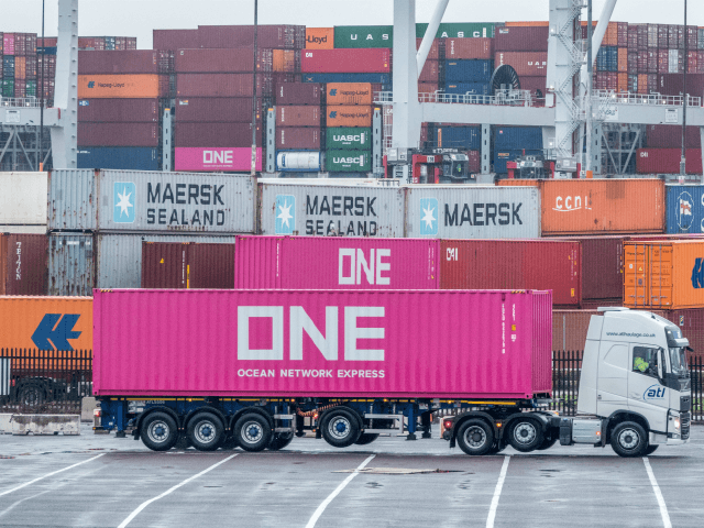 SOUTHAMPTON, ENGLAND - NOVEMBER 20: A lorry passes shipping containers that are stacked at