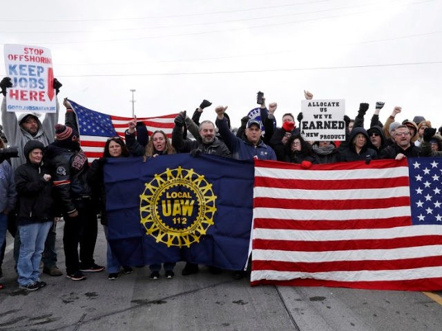 General Motors workers cheer for support outside the plant, Wednesday, March 6, 2019, in Lordstown, Ohio. General Motors' sprawling Lordstown assembly plant near Youngstown is ending production of the Chevrolet Cruze sedan, ending for now more than 50 years of auto manufacturing at the site. (AP Photo/Tony Dejak)