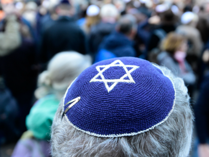 A participant of the 'Berlin wears kippa' rally wears a kippa in Berlin on April 25, 2018. - Germans stage shows of solidarity with Jews after a spate of shocking anti-Semitic assaults, raising pointed questions about Berlin's ability to protect its burgeoning Jewish community seven decades after the Holocaust. (Photo …