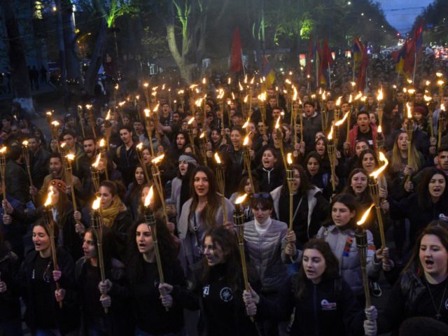 People take part in a torchlight procession as they mark the anniversary of the killing of 1.5 million Armenians by Ottoman forces, Yerevan, April 23, 2019. - Armenians commemorate on April 24, the 104th anniversary of the killing of 1.5 million by Ottoman forces, as a fierce dispute still rages …