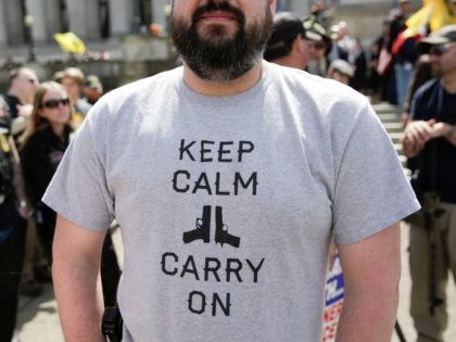 TOPSHOT - A man in a pro-gun shirt is pictured during the 'March for Our Rights' pro-gun rally at the state capitol in Olympia, Washington on April 21, 2018. (Photo by Jason Redmond / AFP) (Photo credit should read JASON REDMOND/AFP/Getty Images)