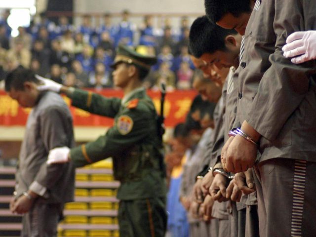 WENZHOU, CHINA: CHINA OUT Chinese police show of a group of hardcore convicts at a sentencing rally in the east Chinese city of Wenzhou 07 April 2004, where 11 prisoners were later executed for various crimes. Amnesty International has called for a moratorium on the death penalty in China, saying …