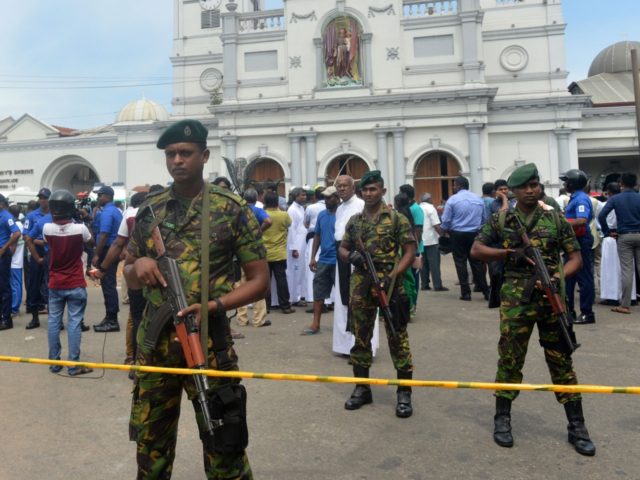 Sri Lankan security personnel keep watch outside the church premises following a blast at the St. Anthony's Shrine in Kochchikade in Colombo on April 21, 2019. - At least 137 people were killed in Sri Lanka on April 21, police sources told AFP, when a string of blasts ripped through â¦