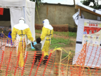 In this file photo dated Sunday, Sept. 9, 2018, health workers walk with a boy suspected as having the Ebola virus at an Ebola treatment centre in Beni, Eastern Congo. According to a WHO announcement Thursday Nov. 29, 2018, Congo’s deadly Ebola outbreak is now the second largest in history, …