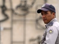 A policeman stands guard in central Havana's Revolution Square a day before Pope Francis' visit to Cuba on September 18, 2015. Havana has received a rush makeover ahead of Pope Francis's arrival in Cuba on Saturday with newly paved streets, a renovated cathedral, repainted buildings and billboards of the pontiff …