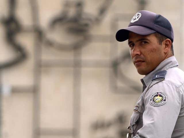 A policeman stands guard in central Havana's Revolution Square a day before Pope Francis'