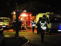 French Gendarmes and firemen work outside a house where five people were found dead on January 21, 2013 in Garons, near Nimes, southern France. The bodies of two adults and three children were found by firemen after a neigbour called for a fire in the afternoon. AFP PHOTO / PASCAL …