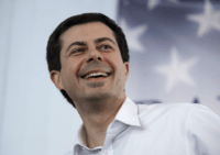 Mayor Pete Buttigieg, of South Bend, Indiana, smiles as he listens to a question during a stop in Raymond, N.H., Saturday, Feb. 16, 2019. Buttigieg is weighing a run in the 2020 presidential race. (AP Photo/Charles Krupa)