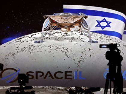 Journalists prepare to attend a press conference by Israeli Aerospace Industries space division to announce the launch of an spacecraft to the moon at the end of 2018 in Yehud, Eastern Tel Aviv, on July 10, 2018. - An Israeli organisation announced plans Tuesday to launch the country's first spacecraft …