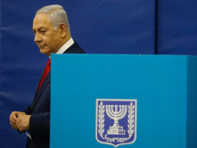 Israels Prime Minister Benjamin Netanyahu votes during Israel's parliamentary elections in