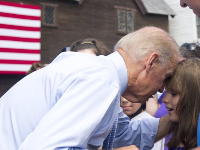 US Vice President Joe Biden touches his head to a young girl's forehead as he greets guets after speaking during a campaign event with US President Barack Obama at Strawbery Banke Field in Portsmouth, New Hampshire, on September 7, 2012. AFP PHOTO / Saul LOEB (Photo credit should read SAUL …