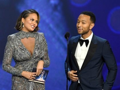 LOS ANGELES, CA - SEPTEMBER 17: Chrissy Teigen (L) and John Legend speak onstage during the 70th Emmy Awards at Microsoft Theater on September 17, 2018 in Los Angeles, California. (Photo by Kevin Winter/Getty Images)