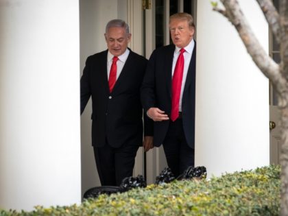 WASHINGTON, DC - MARCH 25: (L-R) Prime Minister of Israel Benjamin Netanyahu and U.S. President Donald Trump walk through the colonnade prior to an Oval Office meeting at the White House March 25, 2019 in Washington, DC. Netanyahu is cutting short his visit to Washington due to a rocket attack …
