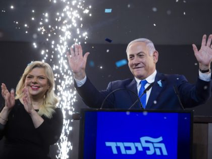 TEL AVIV, ISRAEL - APRIL 10: Prime Minster of Israel, Benjamin Netanyahu and his wife, Sara greet supporters during his after vote speech on April 10, 2019 in Tel Aviv, Israel. Prime Minister Benjamin Netanyahu and Blue and White leader Benny Gantz each declared that they won Tuesday's election after …