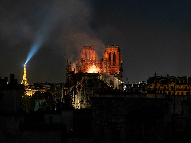 PARIS, FRANCE - APRIL 15: Smoke and flames rise from Notre-Dame Cathedral on April 15, 2019 in Paris, France. A fire broke out on Monday afternoon and quickly spread across the building, collapsing the spire. The cause is yet unknown but officials said it was possibly linked to ongoing renovation …