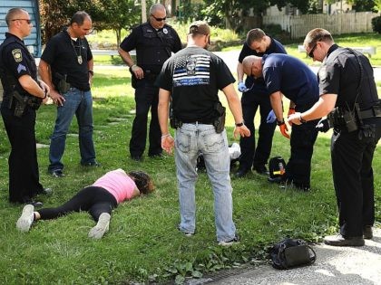 WARREN, OH - JULY 14: Medical workers and police treat a woman who has overdosed on heroin, the second case in a matter of minutes, on July 14, 2017 in Warren, Ohio. According to recent statistics, at least 4,149 Ohioans died from drug overdoses in 2016, a 36 percent leap …