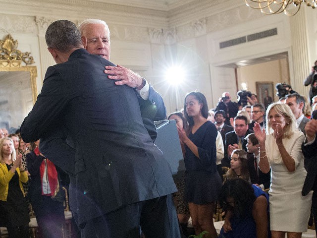 Vice President Joe Biden hugs President Barack Obama after being awarded the Presidential Medal of Freedom with Distinction during a tribute in the State Dining Room of the White House, Jan. 12, 2017. (Official White House Photo by Pete Souza)