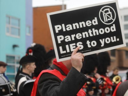 WASHINGTON, DC - FEBRUARY 11: Anti-abortion protestors gather at a demonstration outside a Planned Parenthood office on February 11, 2017 in Washington, DC. Protests were held around the country calling on the government to defund Planned Parenthood. (Photo by Mario Tama/Getty Images)
