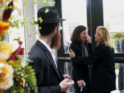 A congregant weeps before a funeral service at the Chabad of Poway Synagogue for Lori Gilbert-Kaye, who was killed in a shooting at the synagogue, in Poway, California, on April 29, 2019. - A rabbi who carried on preaching despite being wounded in the latest deadly shooting at a US …