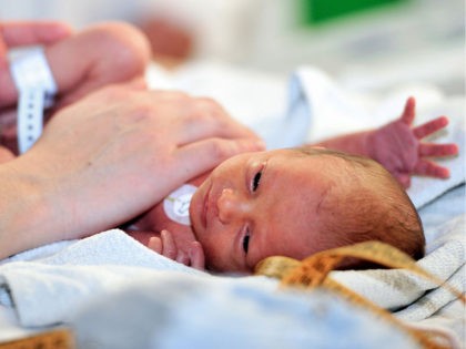 A nurse cares for a premature baby in the neonatal ward of the Centre Hospitalier de Lens